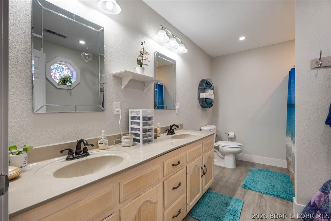 406 South Godfrey Avenue Eldon, MO 65026 - Photo 24 of 66 Primary bath with dual vanities.