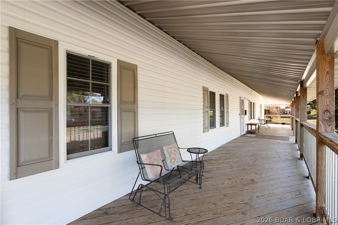 406 South Godfrey Avenue Eldon, MO 65026 - Photo 48 of 66 Expansive covered wrap around deck on the front.