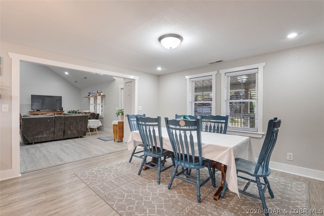 406 South Godfrey Avenue Eldon, MO 65026 - Photo 9 of 66 Dining area with new flooring and paint refresh.