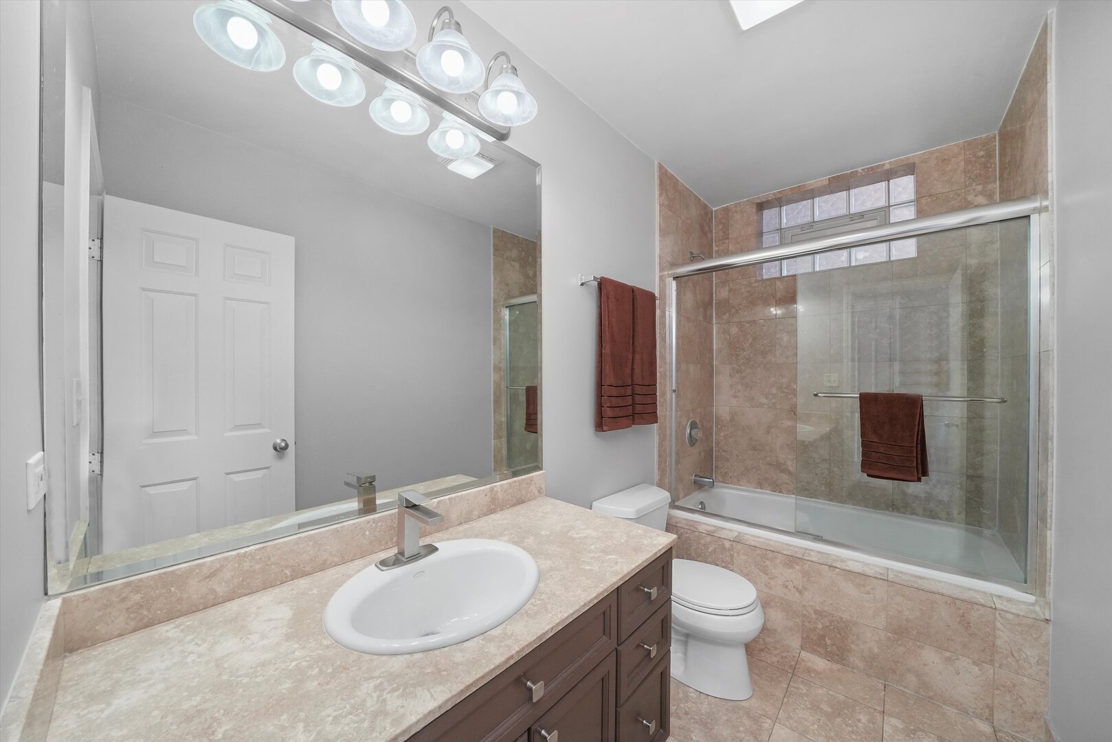 2515 West Harrison Street, Unit 1 Chicago, IL 60612 - Photo 16 of 43 a bathroom with a sink a toilet and shower