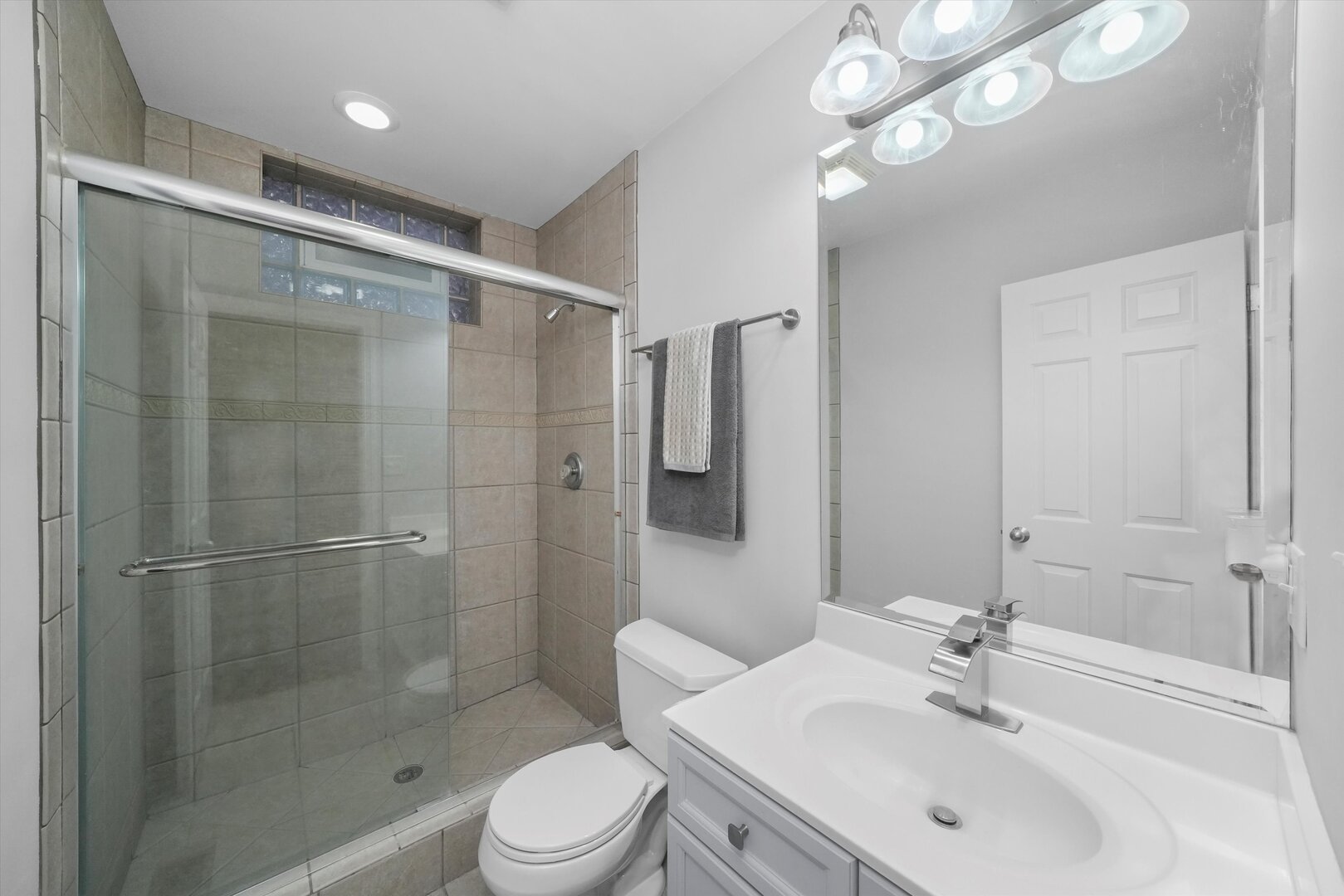 2515 West Harrison Street, Unit 1 Chicago, IL 60612 - Photo 18 of 43 a bathroom with a sink shower and a mirror