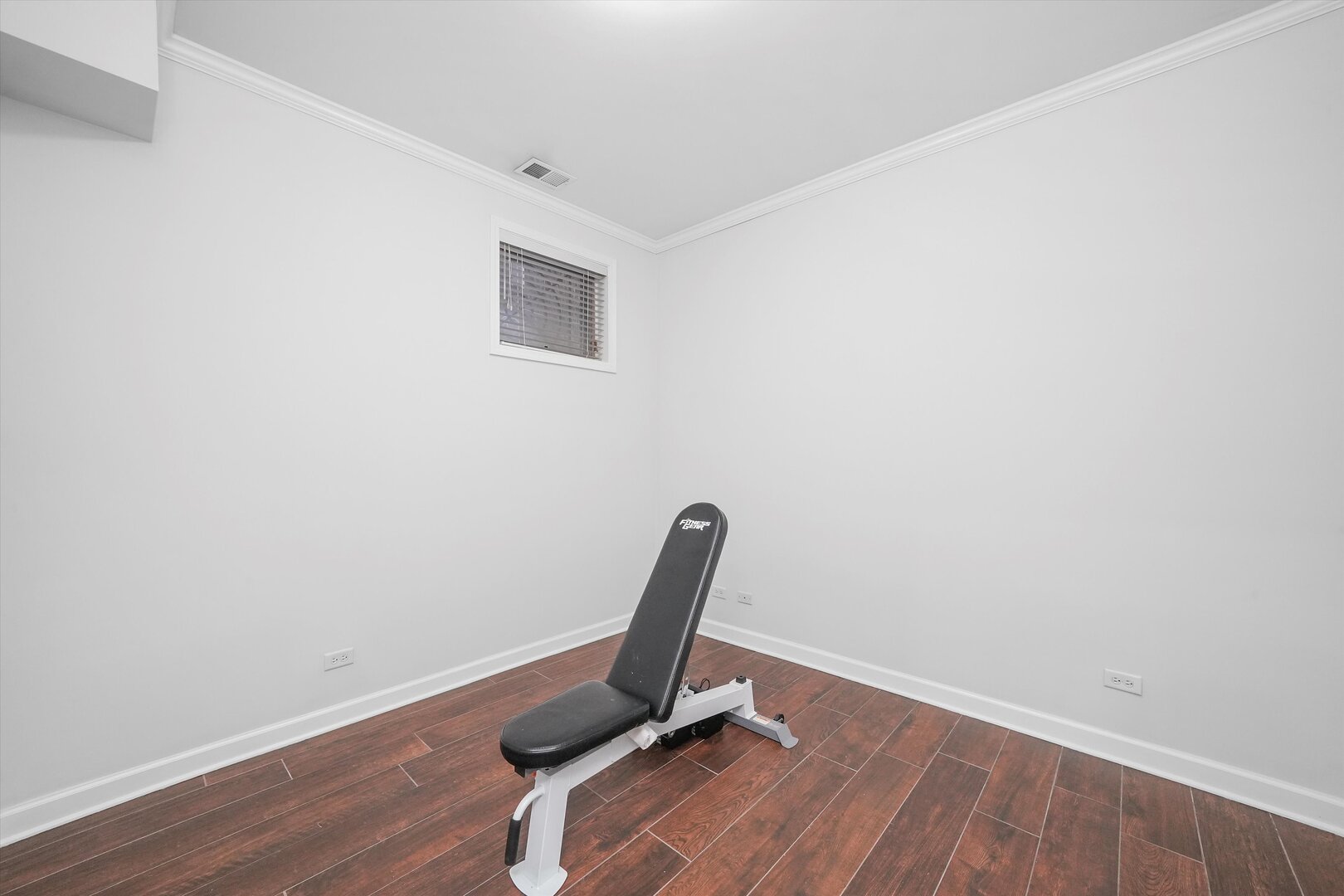 2515 West Harrison Street, Unit 1 Chicago, IL 60612 - Photo 34 of 43 a view of a room with wooden floor and a chair