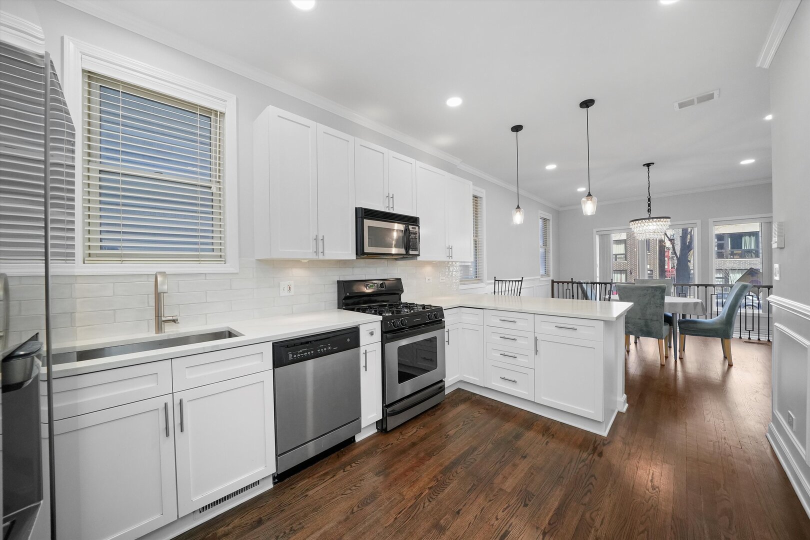 2515 West Harrison Street, Unit 1 Chicago, IL 60612 - Photo 10 of 43 a kitchen with white cabinets and white appliances
