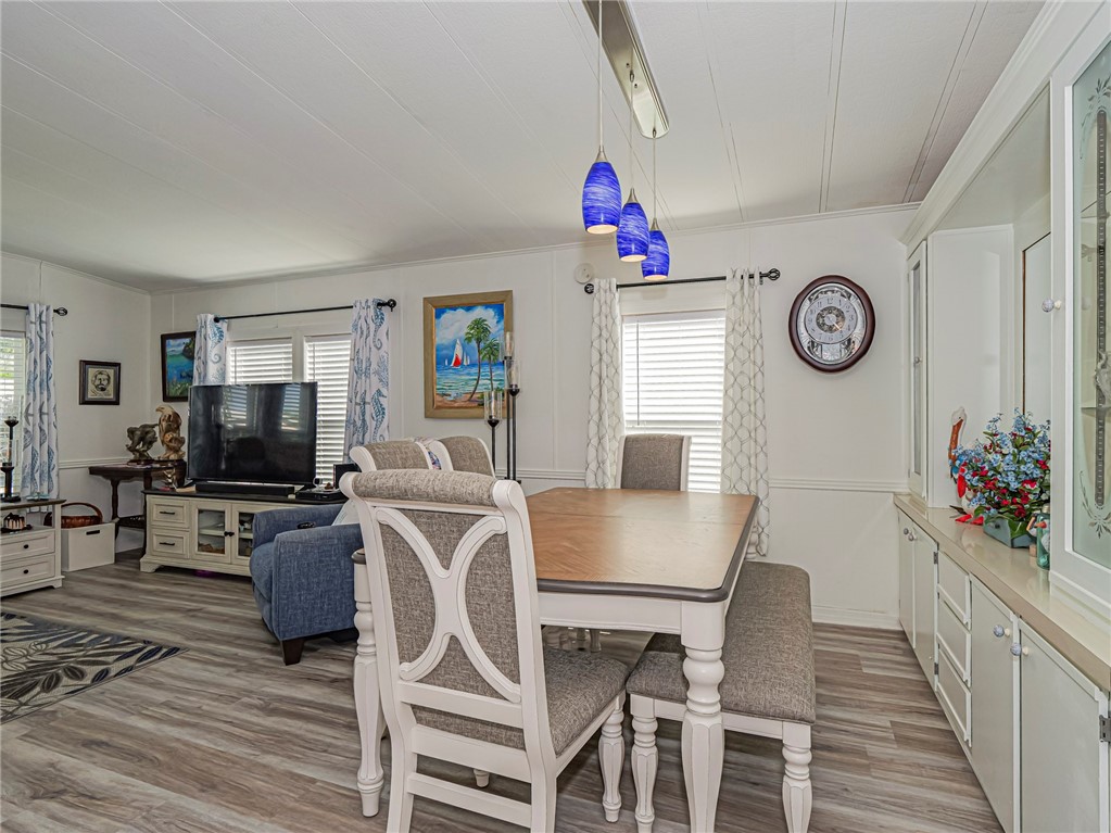 409 Avocado Drive Sebastian, FL 32976 - Photo 18 of 35 a view of a dining room with furniture and a window