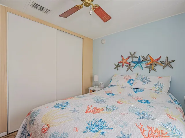 a bedroom with a bed and a table