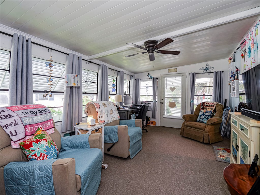 409 Avocado Drive Sebastian, FL 32976 - Photo 28 of 35 a living room with furniture and a large window