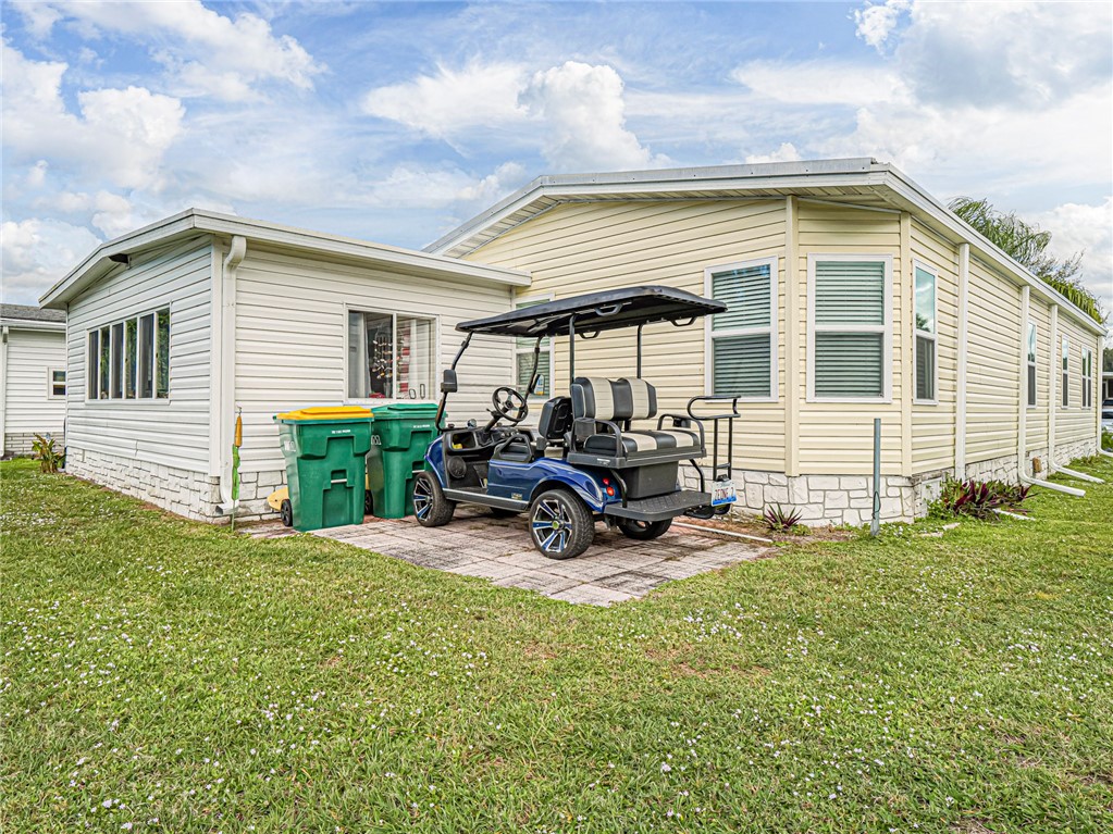 409 Avocado Drive Sebastian, FL 32976 - Photo 35 of 35 a view of a house with backyard sitting area and porch