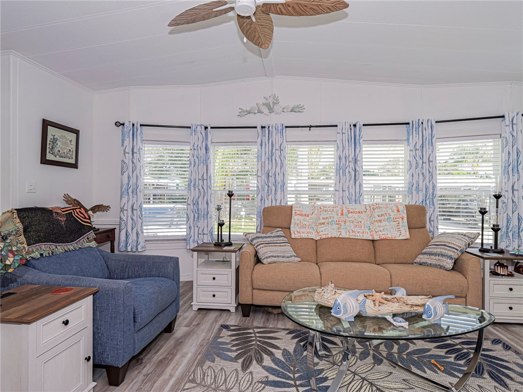 409 Avocado Drive Sebastian, FL 32976 - Photo 10 of 35 a living room with furniture and a large window
