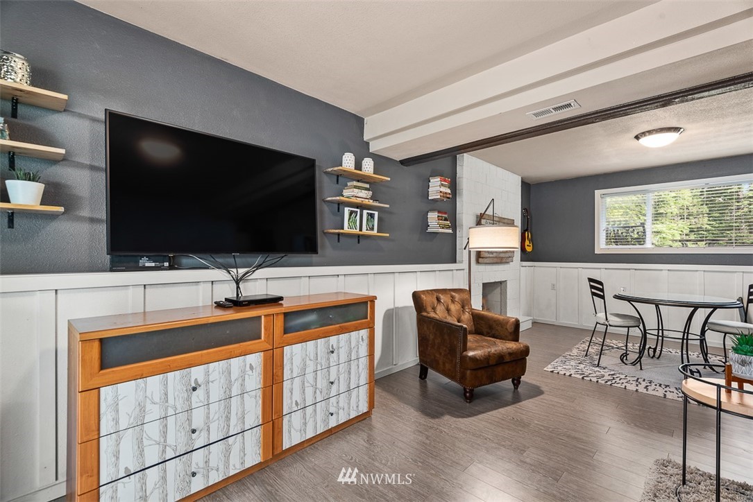 4426 196th Street Southeast Bothell, WA 98012 - Photo 22 of 36 a living room with furniture and a flat screen tv
