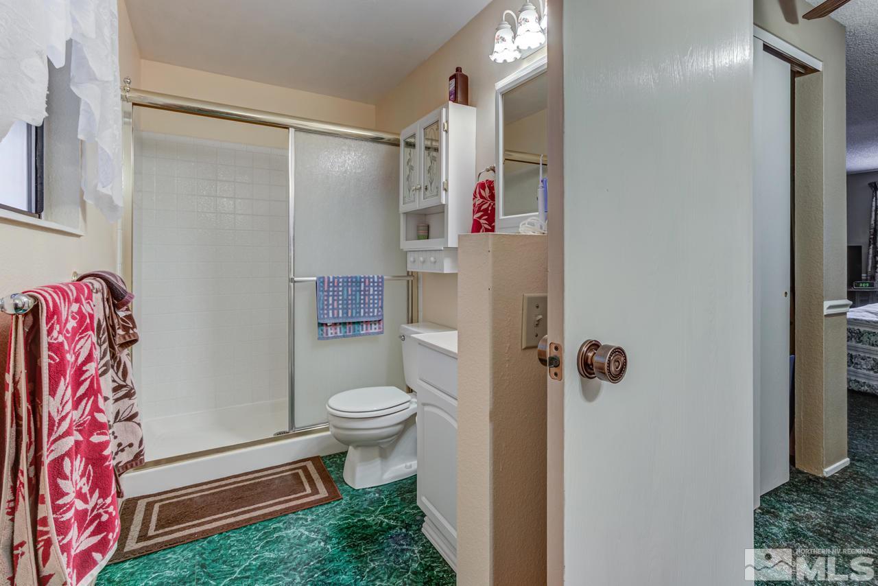 1985 Mayberry Drive Reno, NV 89509 - Photo 11 of 21 a bathroom with a sink toilet and shower