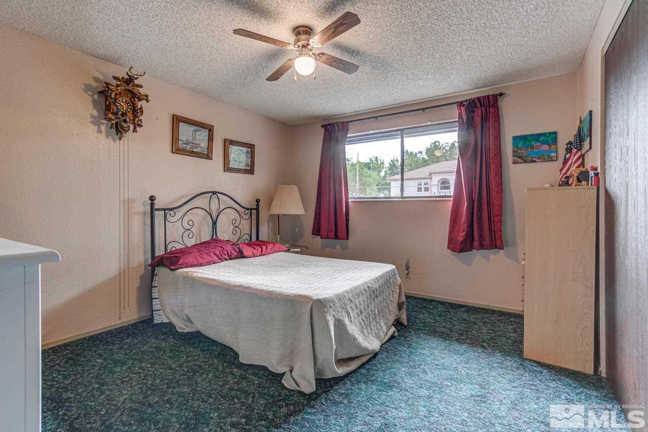 1985 Mayberry Drive Reno, NV 89509 - Photo 12 of 21 a bedroom with a bed and a window