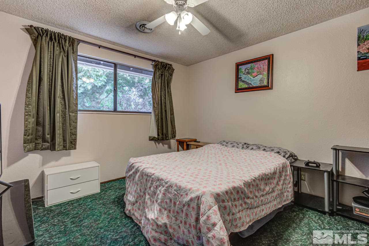 1985 Mayberry Drive Reno, NV 89509 - Photo 13 of 21 a bedroom with a bed and a window