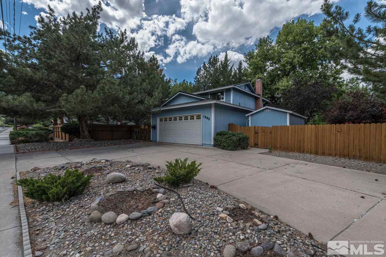 1985 Mayberry Drive Reno, NV 89509 - Photo 2 of 21 a front view of a house with garden