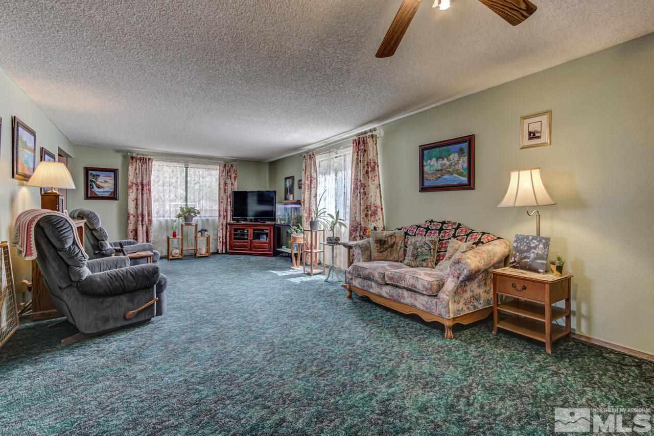 1985 Mayberry Drive Reno, NV 89509 - Photo 6 of 21 a living room with furniture and a flat screen tv