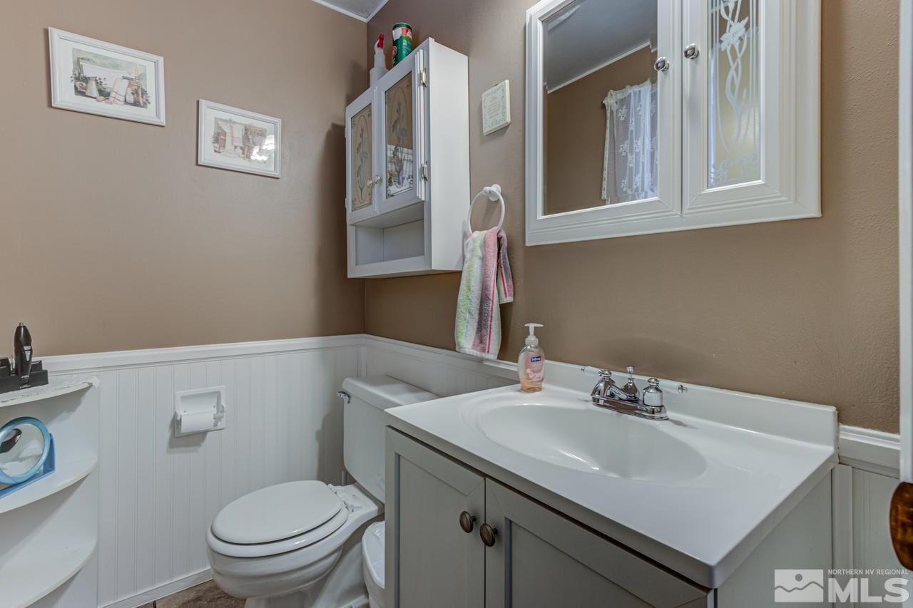 1985 Mayberry Drive Reno, NV 89509 - Photo 9 of 21 a bathroom with a sink toilet and a mirror