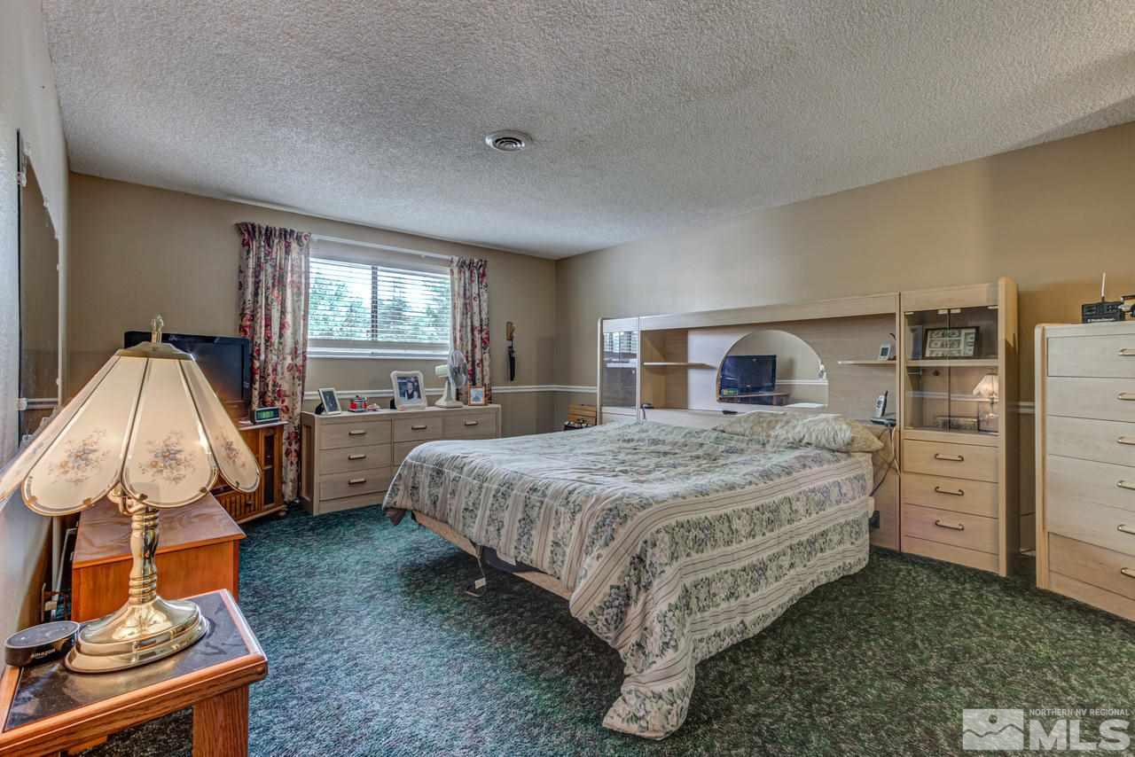 1985 Mayberry Drive Reno, NV 89509 - Photo 10 of 21 a bedroom with a bed and dresser
