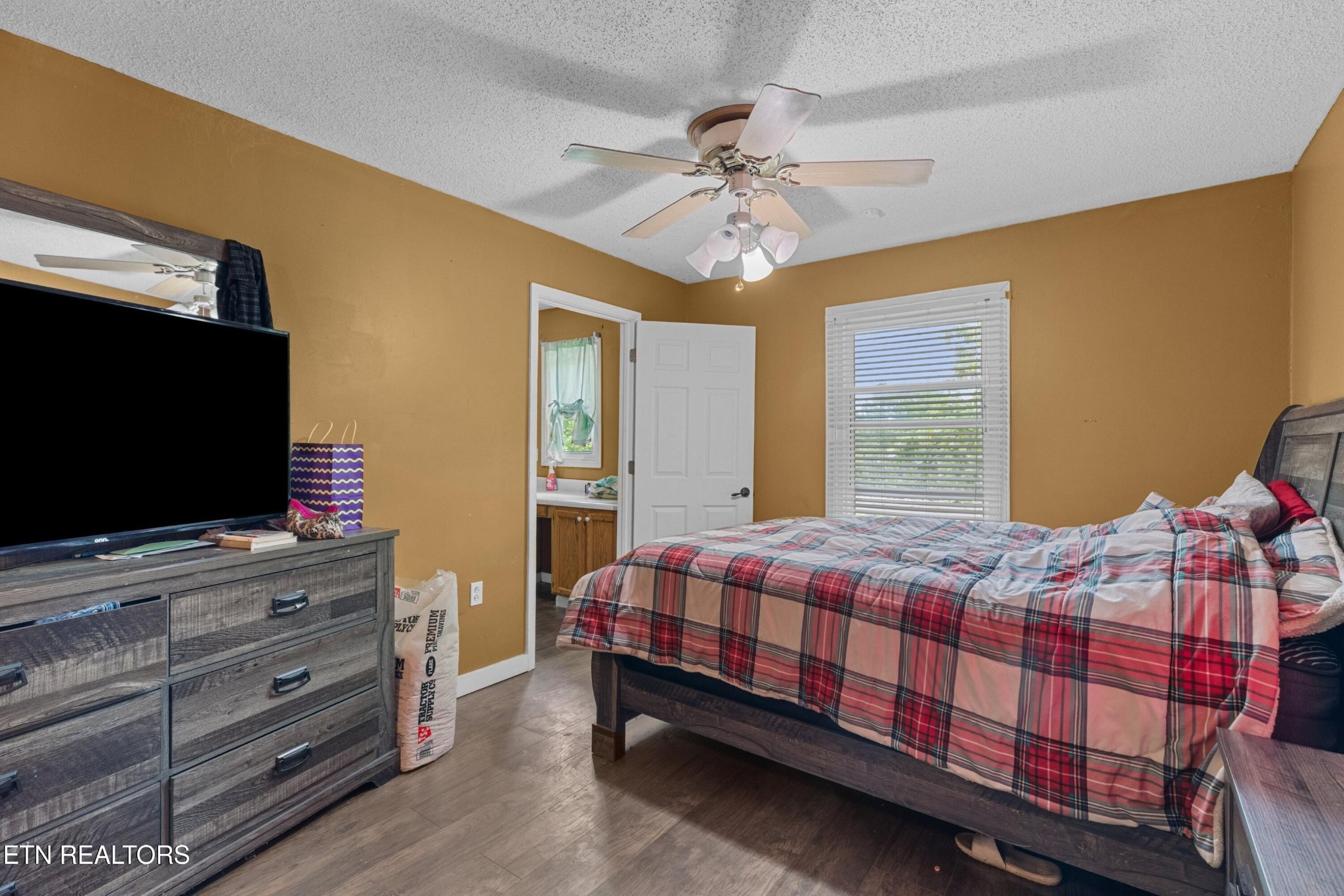 630 South Proctor Boulevard Oneida, TN 37841 - Photo 13 of 32 a bedroom with a bed and flat screen tv