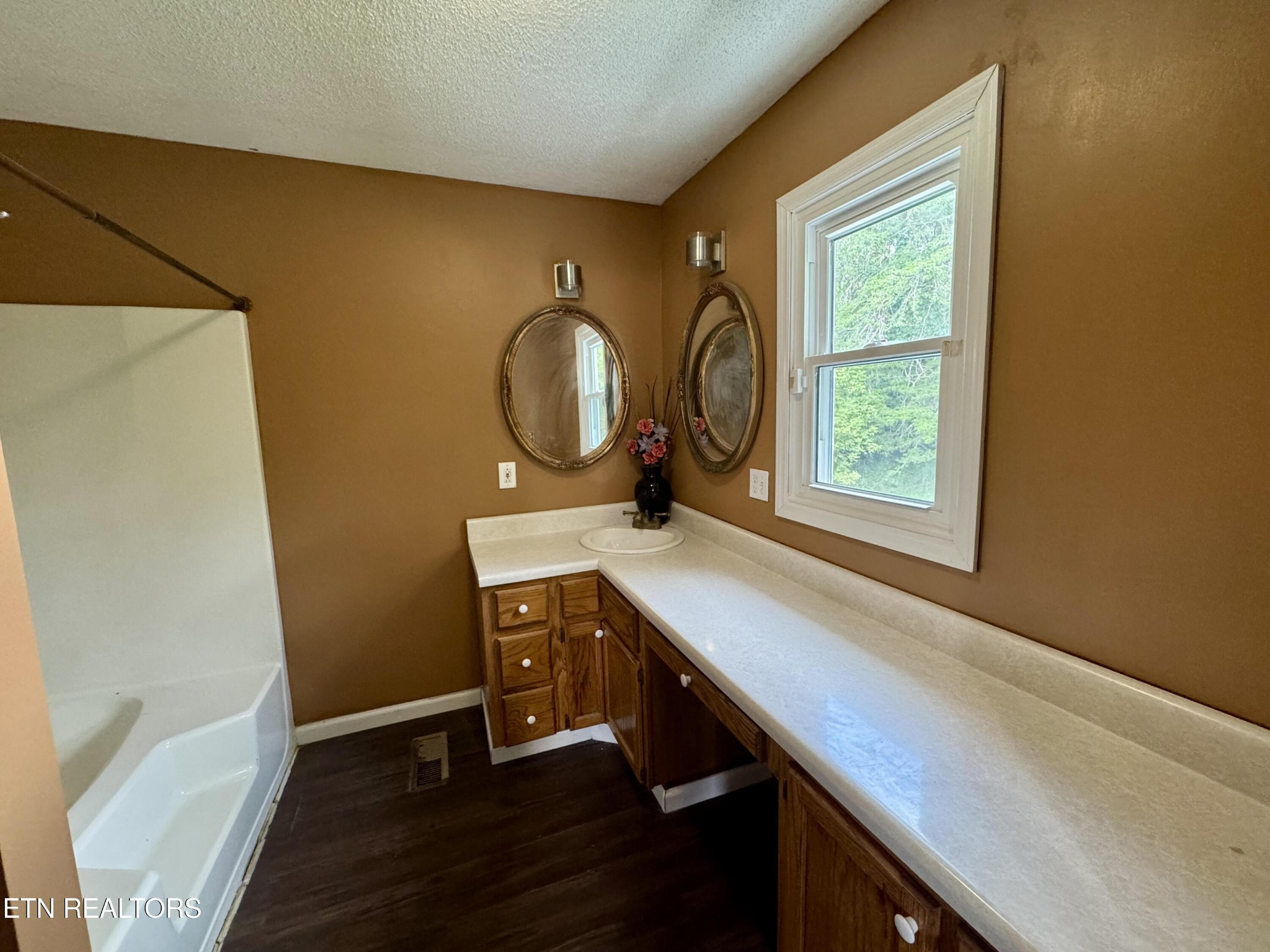 630 South Proctor Boulevard Oneida, TN 37841 - Photo 16 of 32 a view of workspace with wooden floor windows and sink