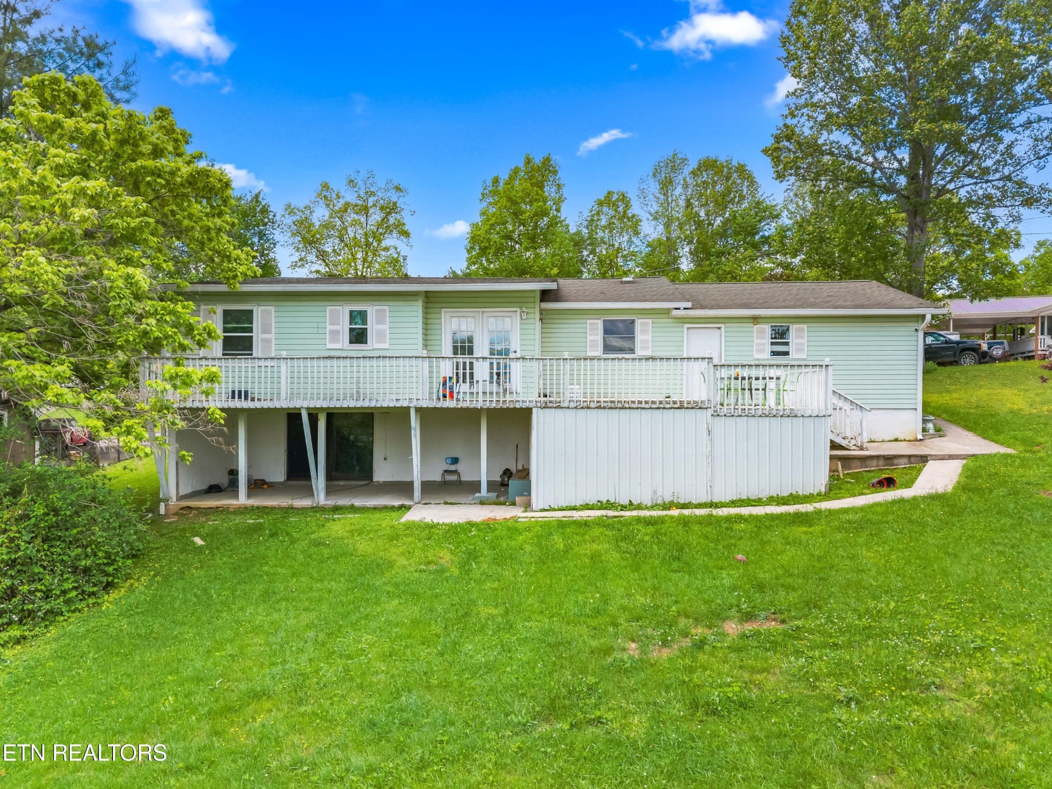 630 South Proctor Boulevard Oneida, TN 37841 - Photo 2 of 32 a view of a house with a yard and sitting area
