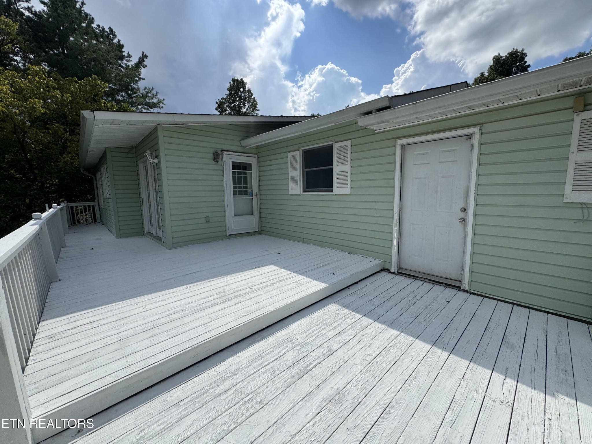630 South Proctor Boulevard Oneida, TN 37841 - Photo 3 of 32 a view of a house with a roof deck