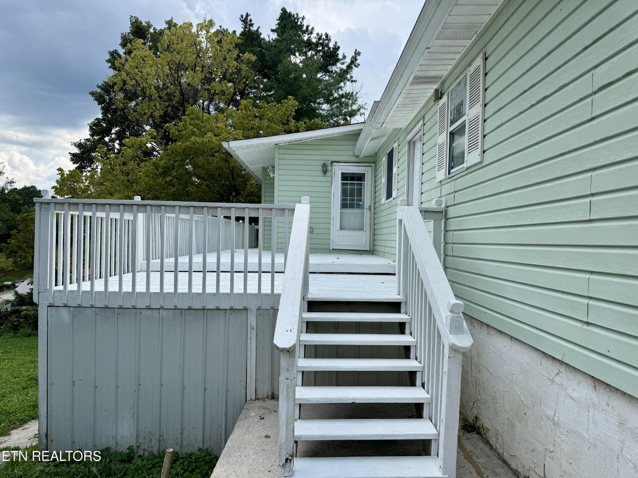 630 South Proctor Boulevard Oneida, TN 37841 - Photo 5 of 32 a view of a house with wooden deck