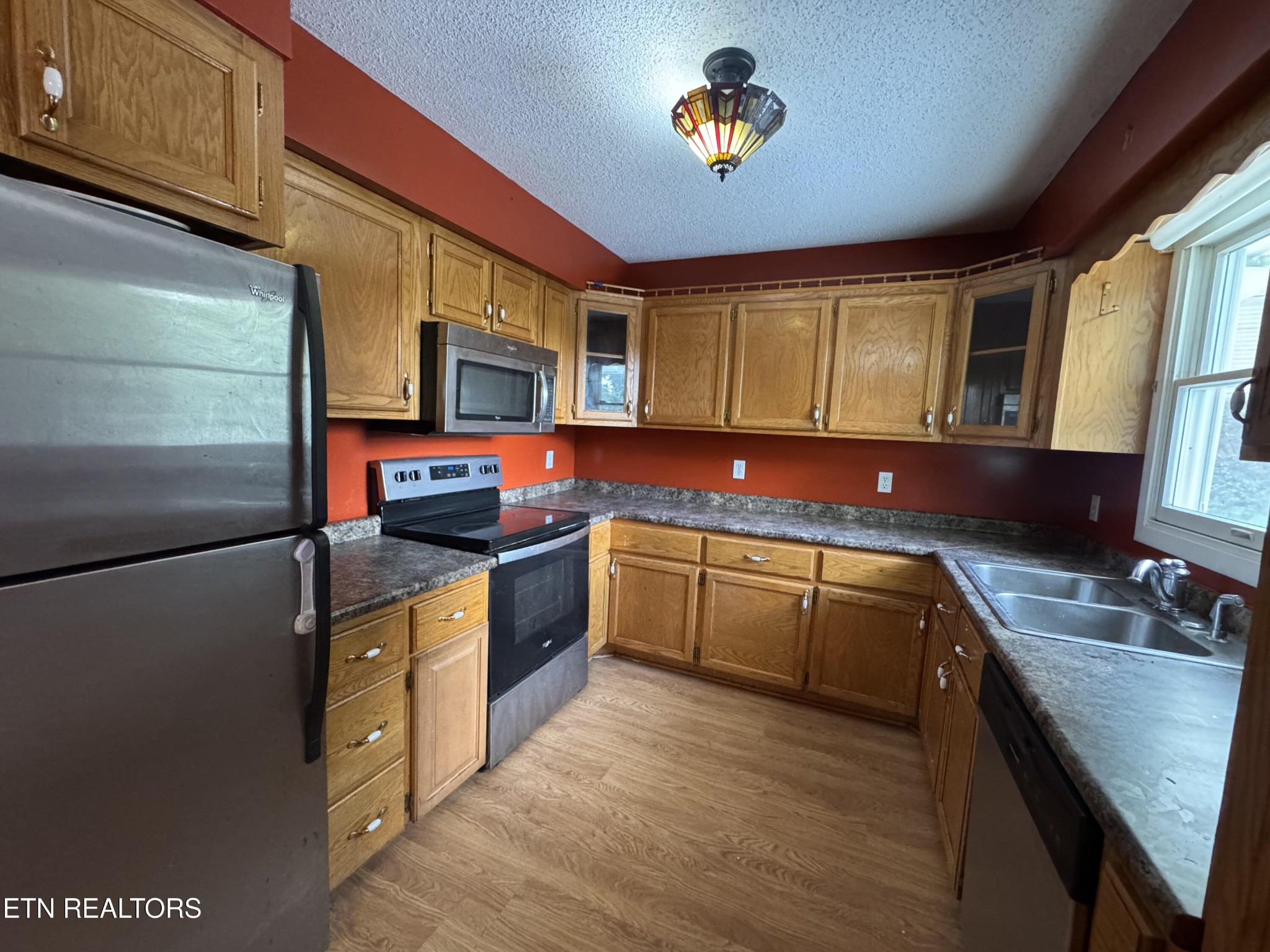 630 South Proctor Boulevard Oneida, TN 37841 - Photo 10 of 32 a kitchen with stainless steel appliances granite countertop a sink stove and cabinets
