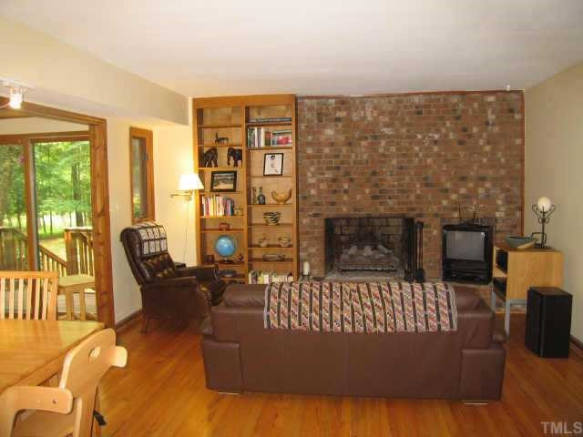 3523 West Cornwallis Road Durham, NC 27705 - Photo 5 of 10 The spacious Family Room is anchored by a wonderful floor-to-ceiling brick hearth, and offers built-in bookcases and great views to the backyard. Other
