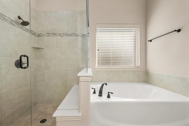 a bath tub sitting next to a window