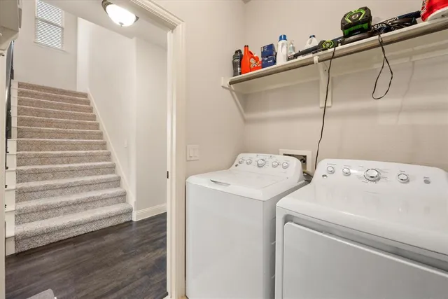 a view of storage and utility room with washer and dryer