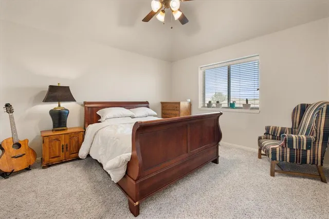 a bedroom with bed and window