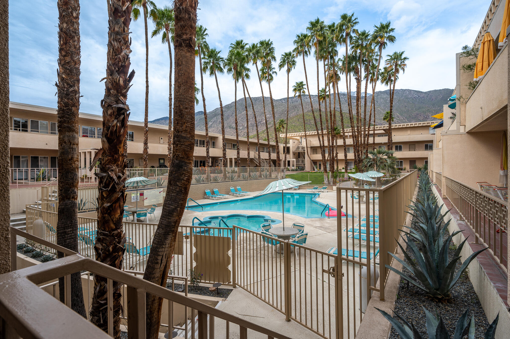 277 East Alejo Road, Unit 113 Palm Springs, CA 92262 - Photo 19 of 27 a view of balcony and wooden floor