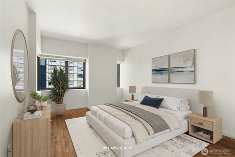 a bedroom with a large bed and a window