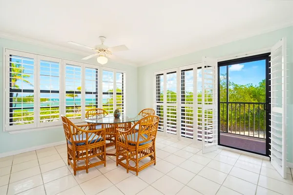 a view of a dining room with furniture window and outside view