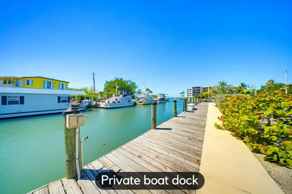 a view of swimming pool with outdoor seating and yard