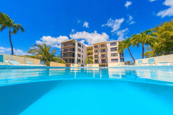 a balcony with table and chairs