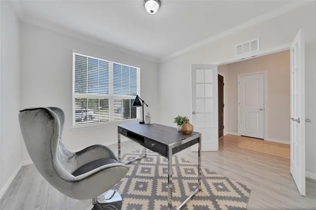 a workspace with furniture and window