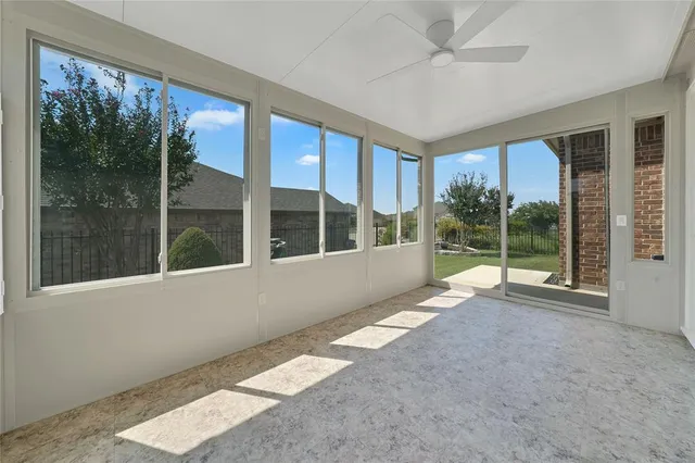 a view of an empty room with a large window