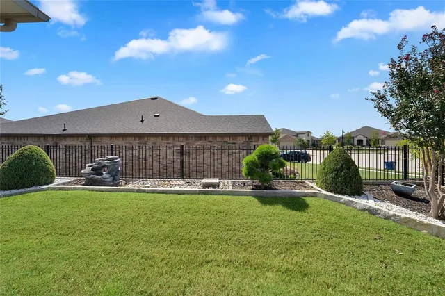 a view of a house with a yard porch and sitting area