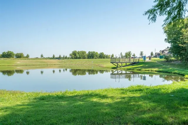 a view of a lake with a big yard