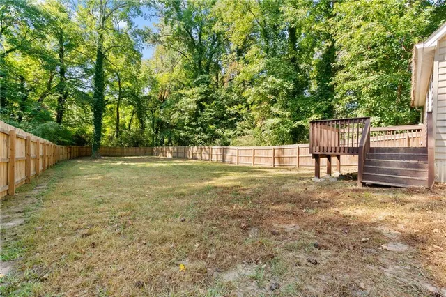 a view of backyard with green space