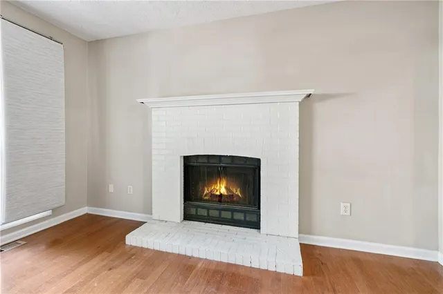a living room with a fireplace