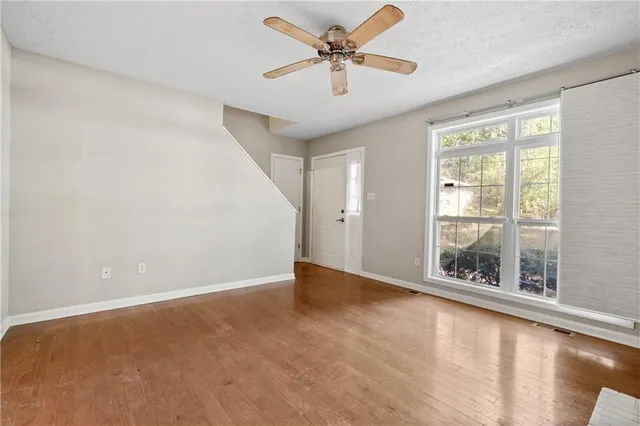 a view of an empty room with a window