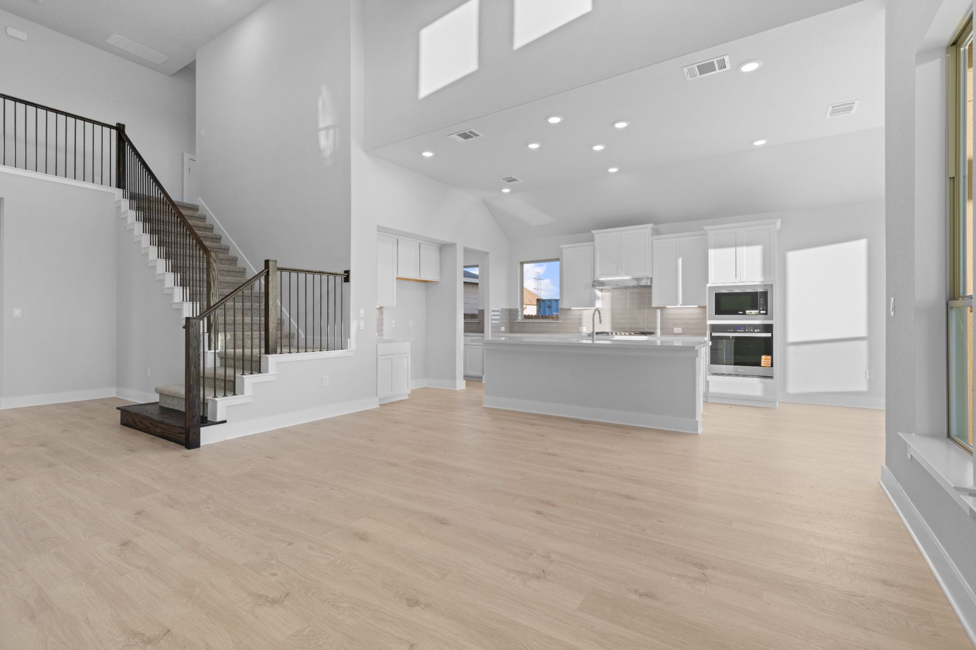 17421 Graces Path Pflugerville, TX 78660 - Photo 16 of 38 From Family Room to Open Concept Kitchen