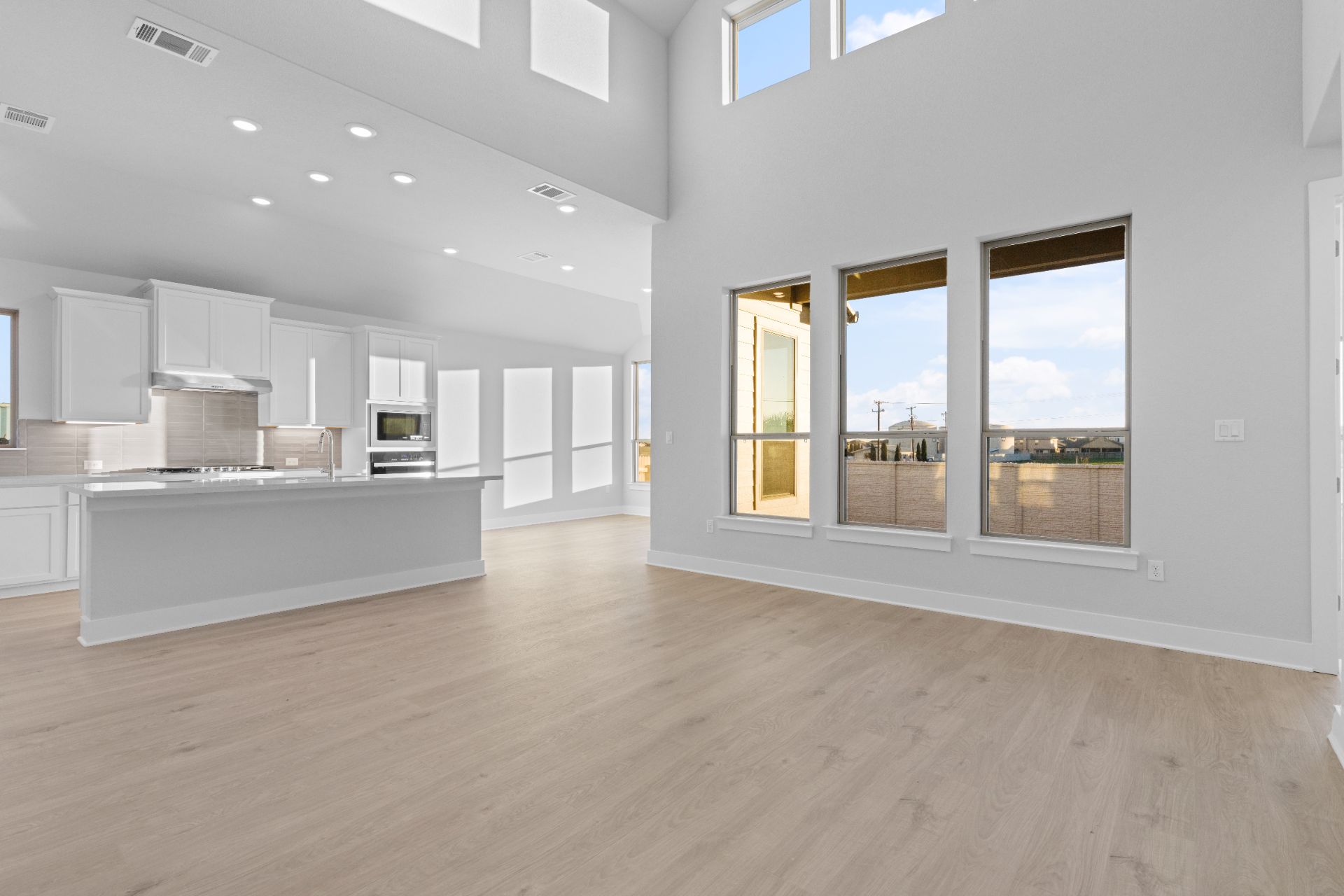 17421 Graces Path Pflugerville, TX 78660 - Photo 17 of 38 From Family Room to Open Concept Kitchen