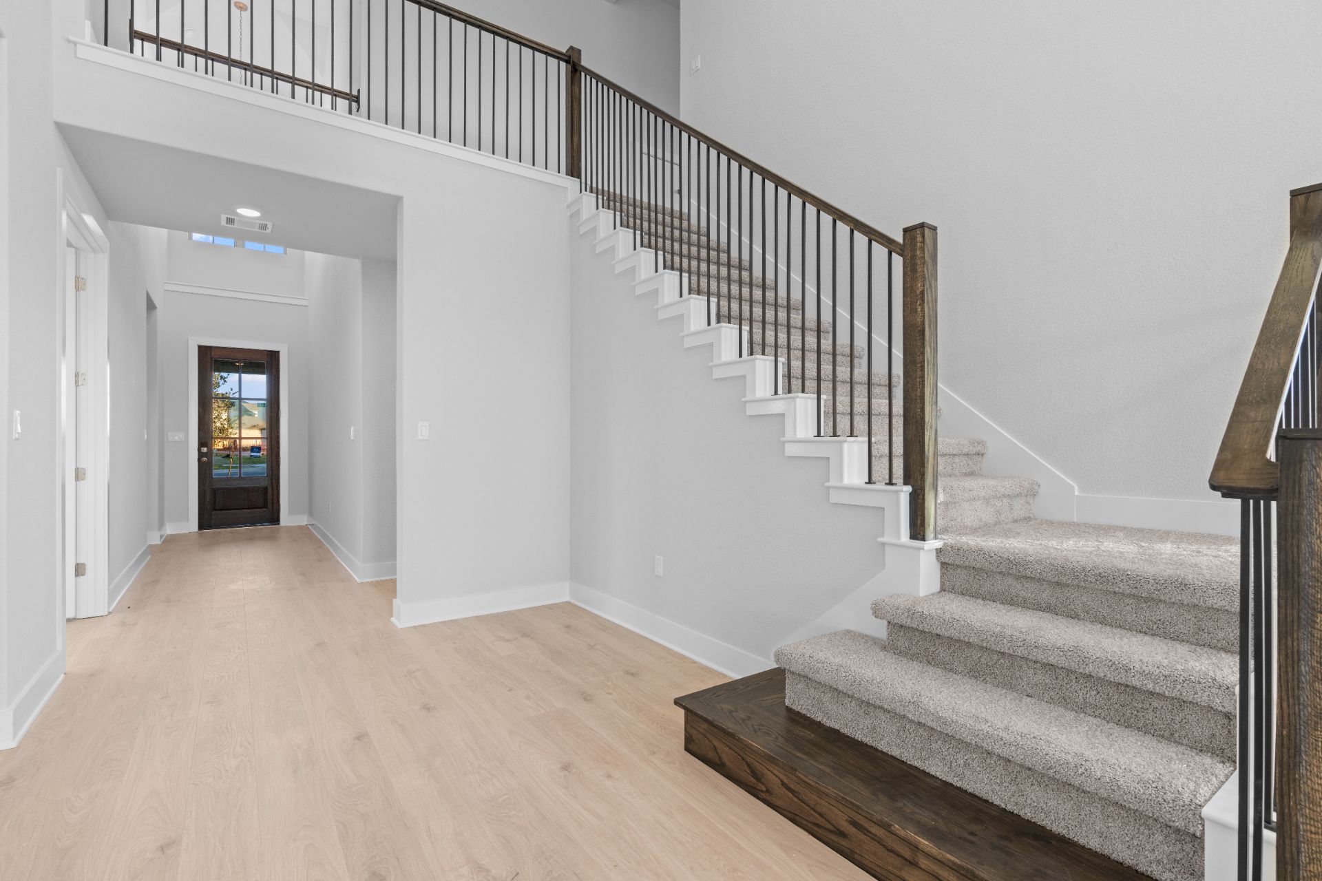 17421 Graces Path Pflugerville, TX 78660 - Photo 3 of 38 Entry Foyer with grand staircase and soaring ceiling