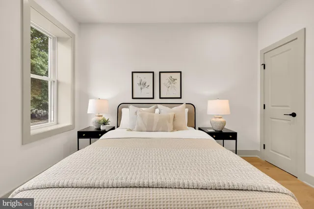 a bathroom with a granite countertop sink a toilet and bathtub