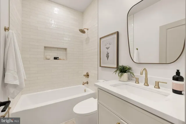 a potted plant sitting on top of a sink