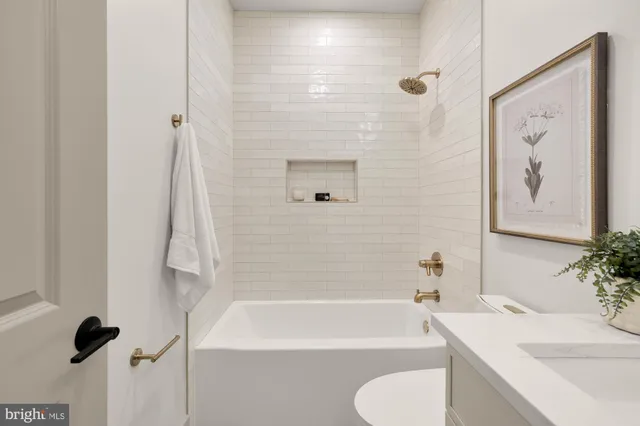 a view of a roof deck with table and chairs a barbeque with wooden floor and fence