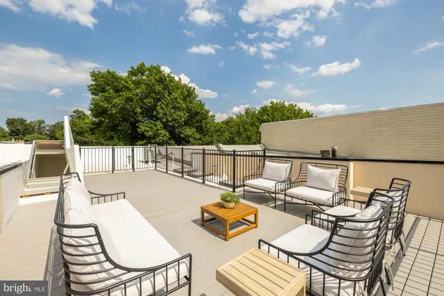 a living room with furniture and rug