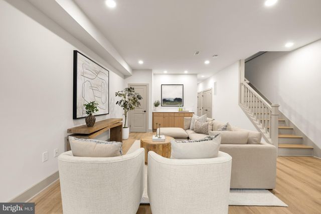 a bedroom with a bed and a night stand